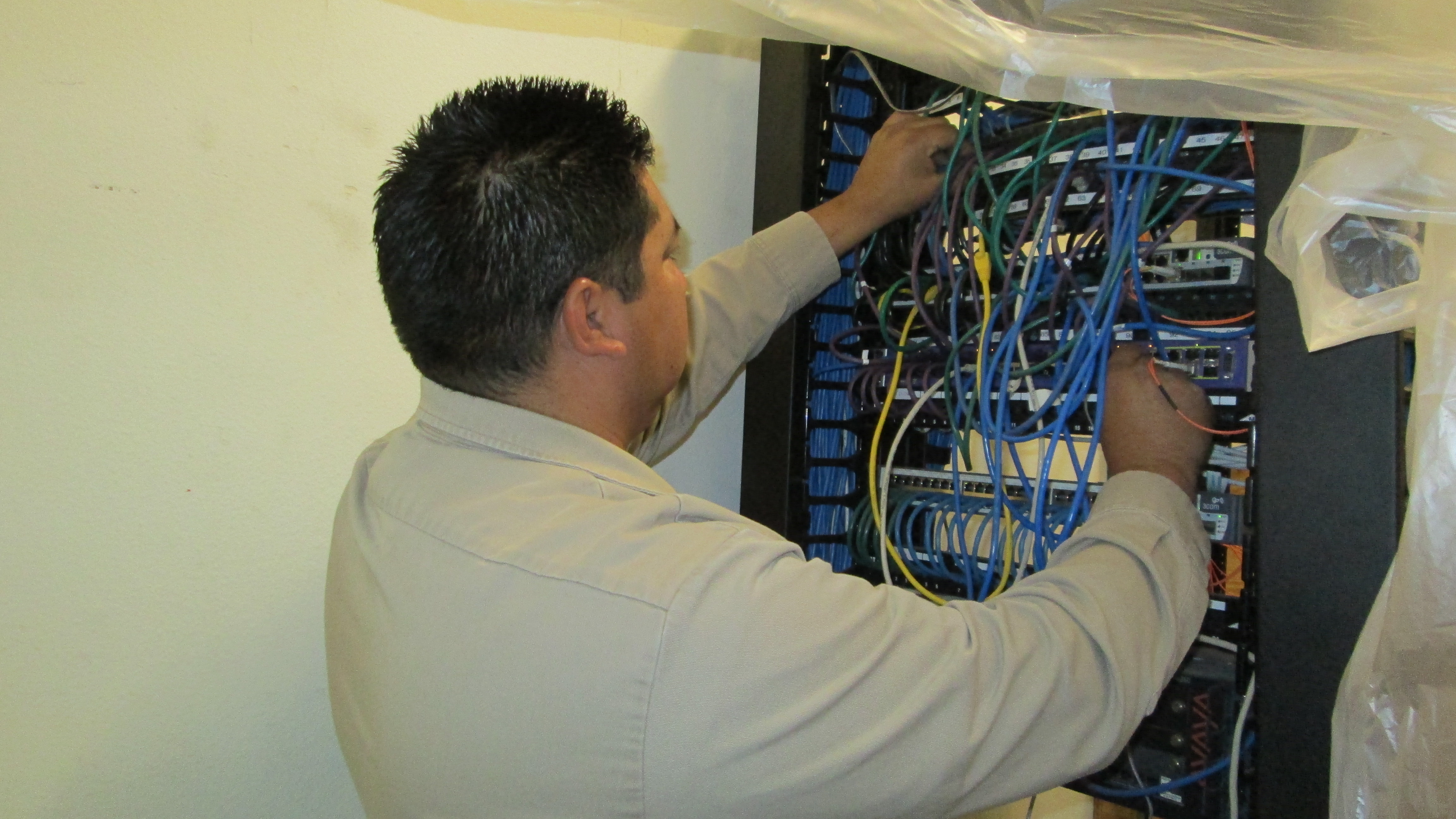 A man working in an electrical panel